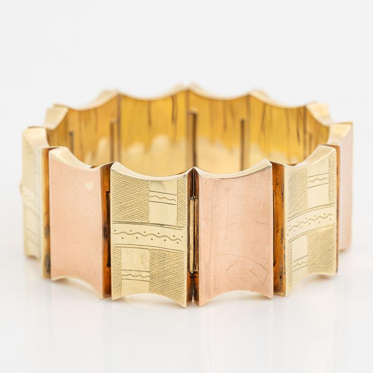 A 14K gold bracelet.