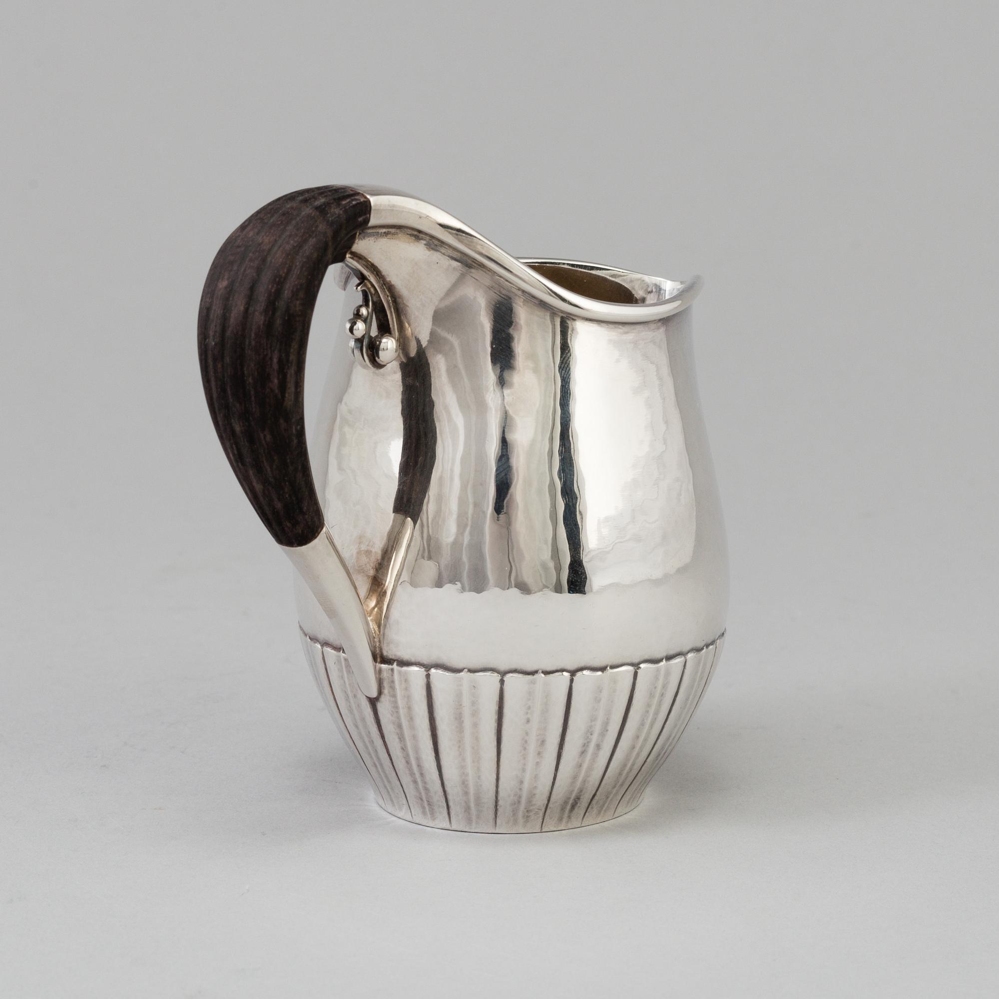 A"Cosmos", cream jug, sterling silver. Designed by Johan Rodhe for Georg Jensen, modell no 45E, weight 175 grams.