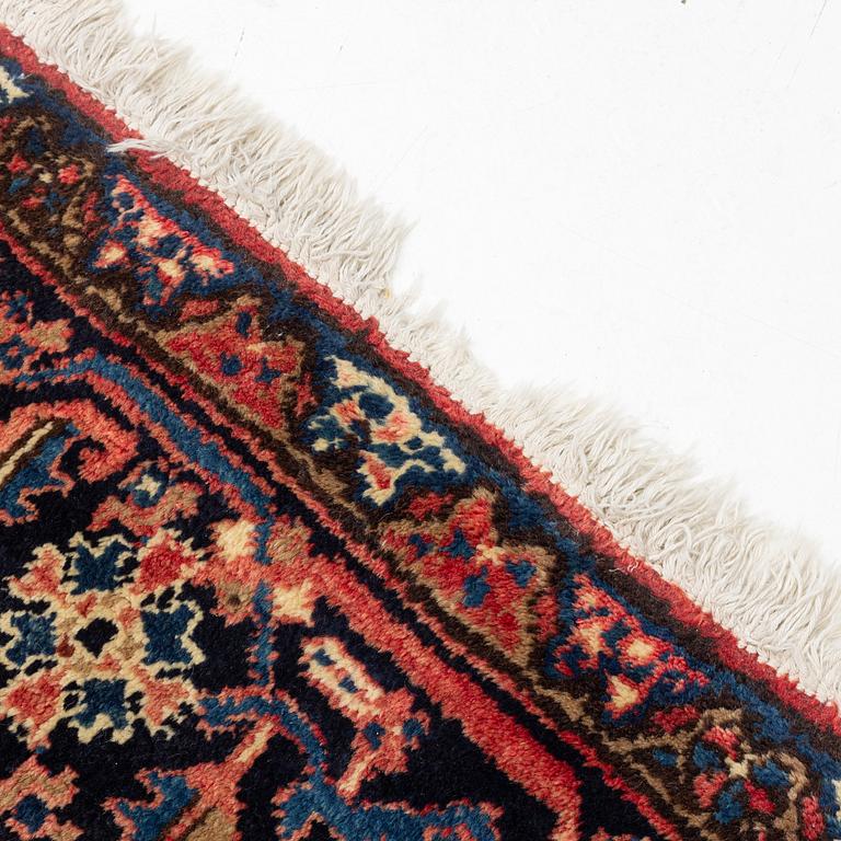 An oriental carpet, c. 330 x 285 cm.