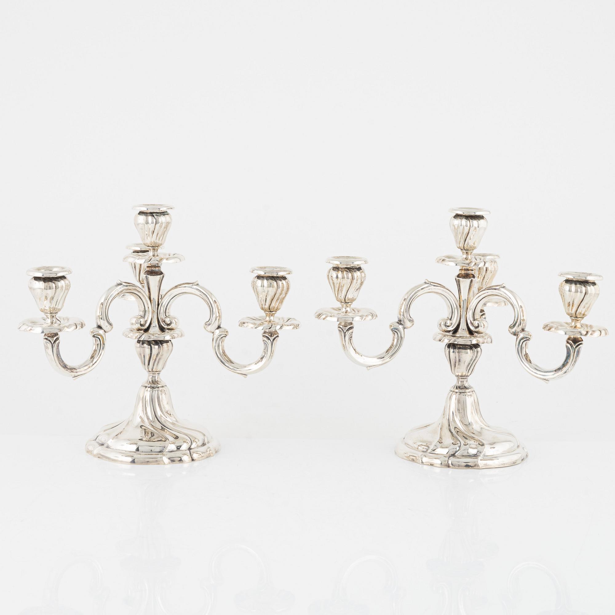 A pair of silver Rococo-style candelabra, Germany, first half of the 20th century.