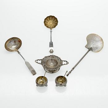 A pair of Russian silver salt cellars, a sprinkle spoon, a sauce ladle, and a tea strainer, Finnish marks.