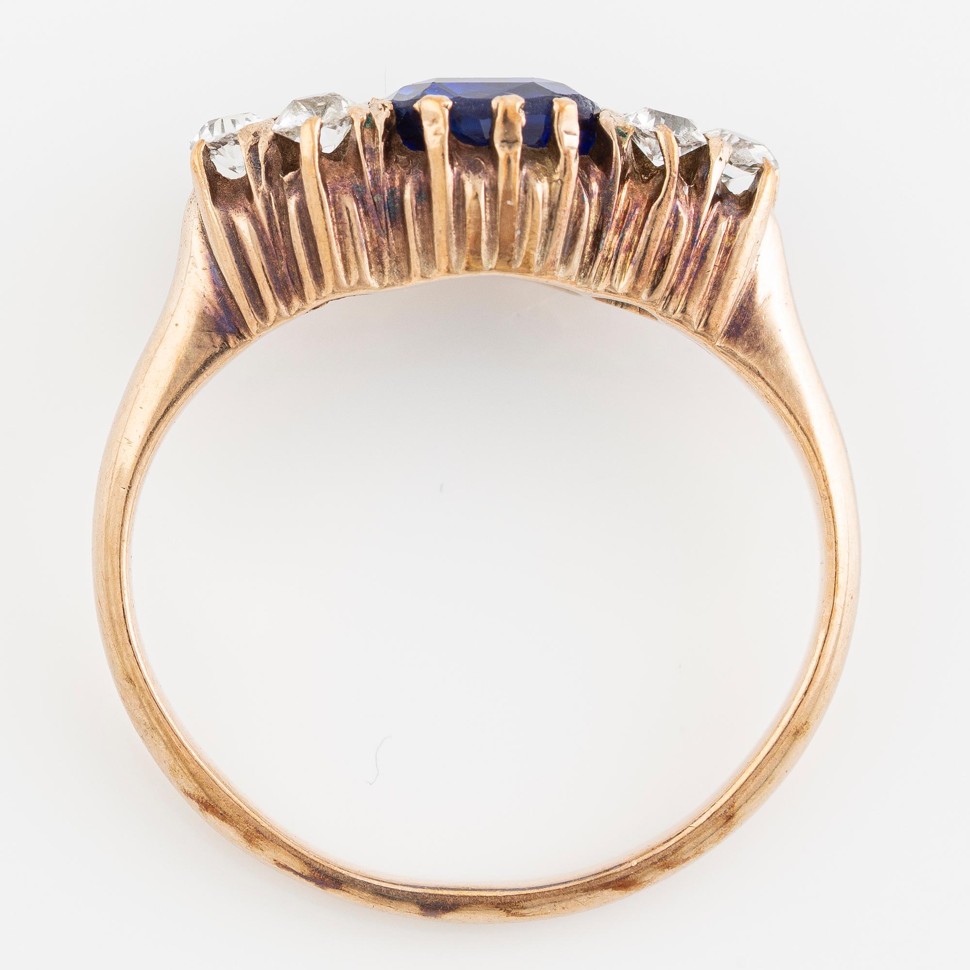 Ring, 14K gold with blue sapphire and white stones.