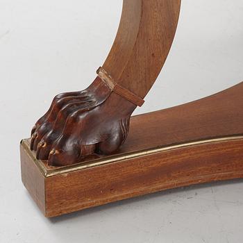 A mahogany veneered Empire style table, first half the 20th Century.