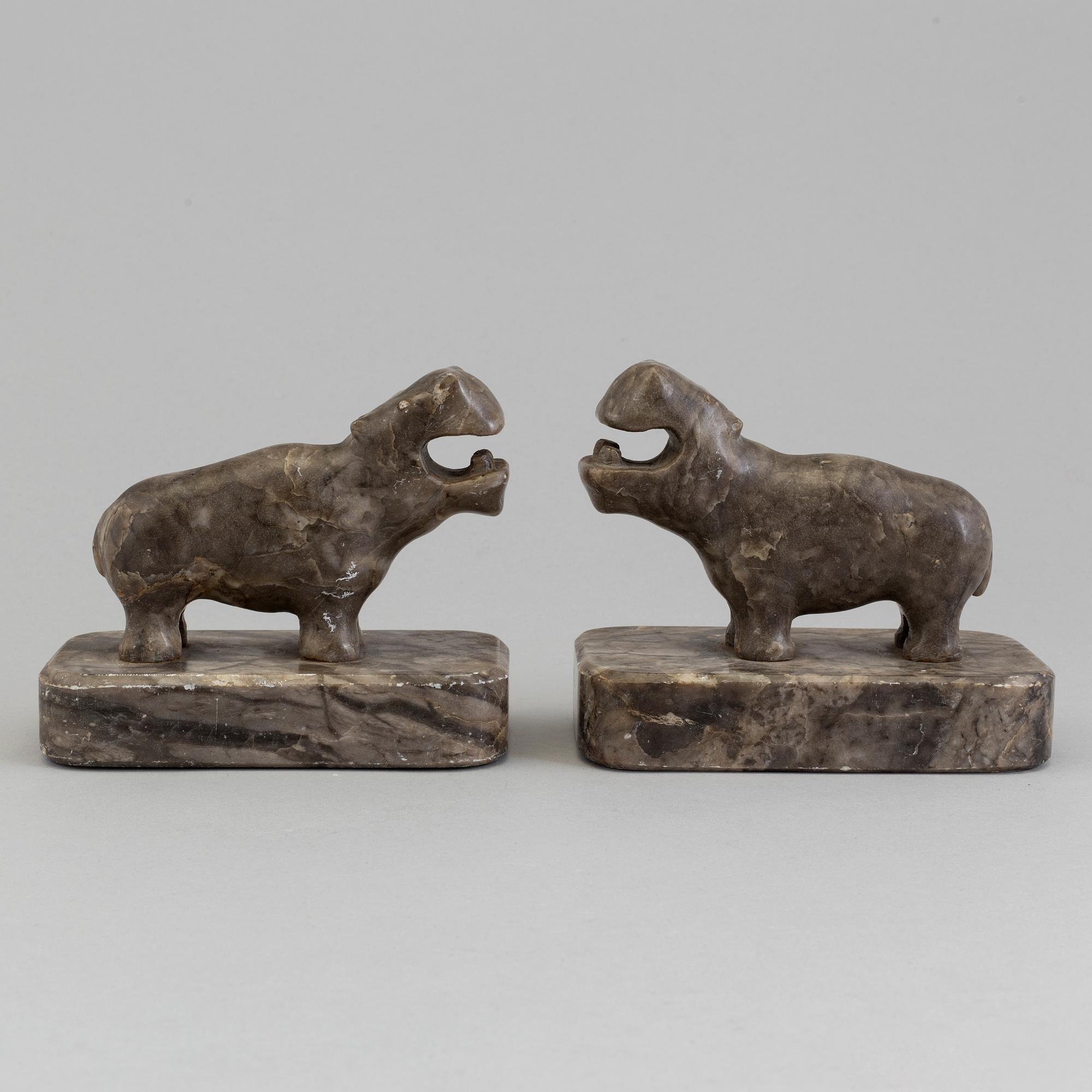A pair of stone book ends, early 20th century.