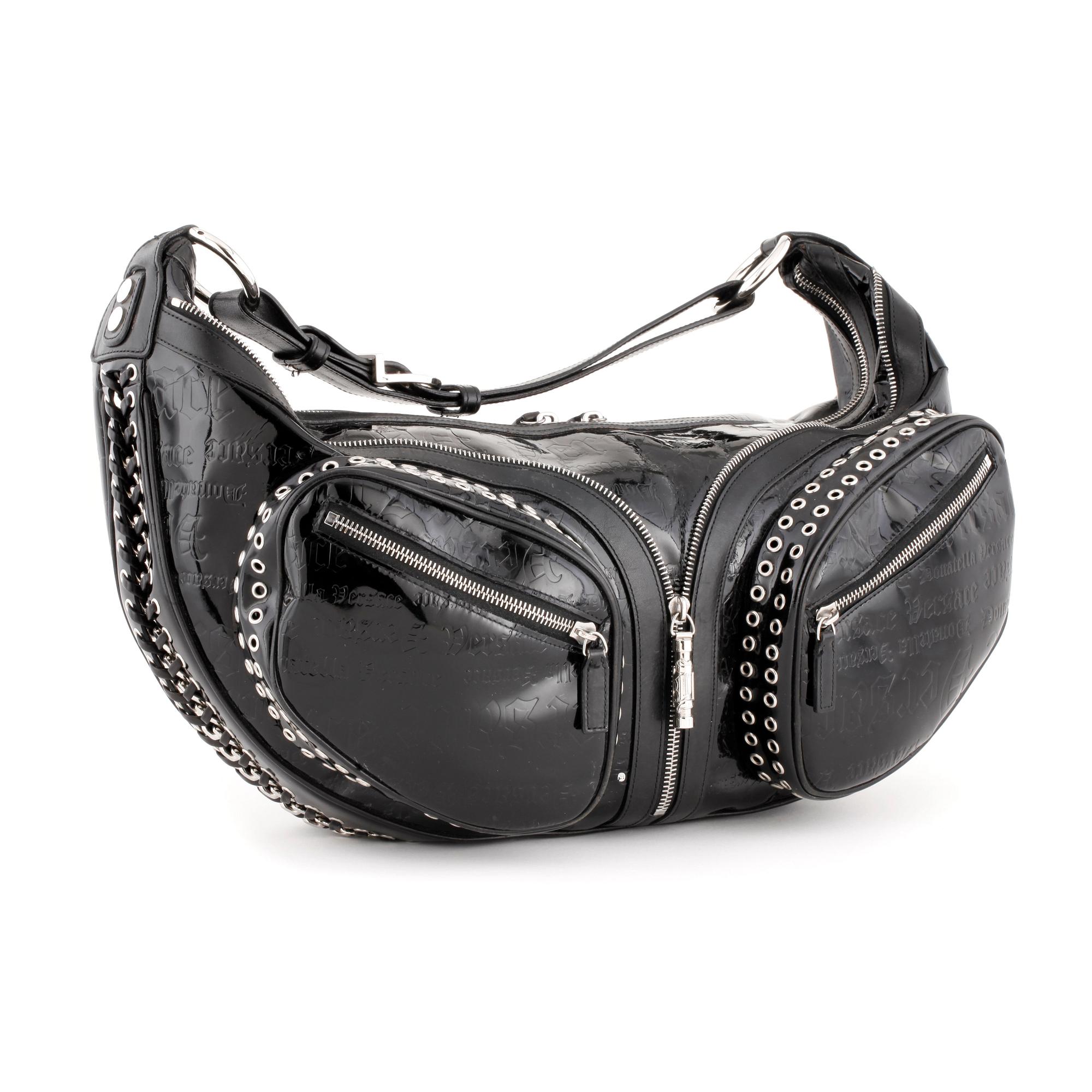 VERSACE, a black patented leather handbag.