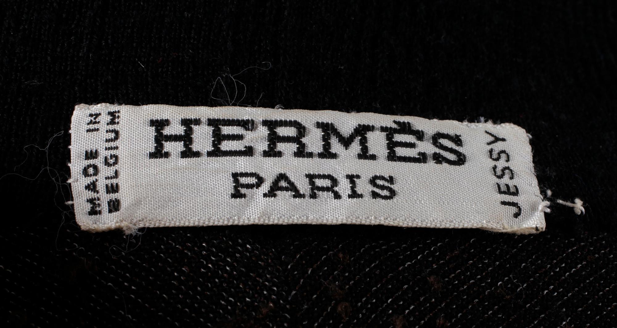A black 1960s/70s cape by Hermès.
