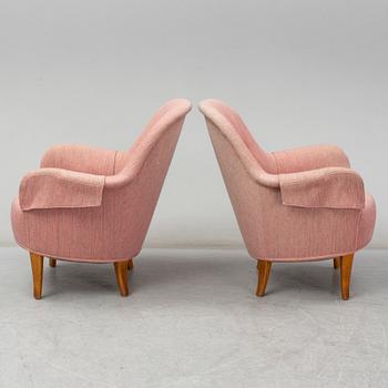 A pair of second half of the 20th Century 'Cirkus' easy chairs by Carl Malmsten.