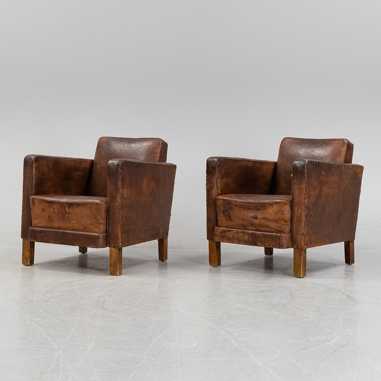 Björn Trädgård, attributed to, a pair of leather lounge chairs from Firma Svenskt Tenn, mid 20th Century.