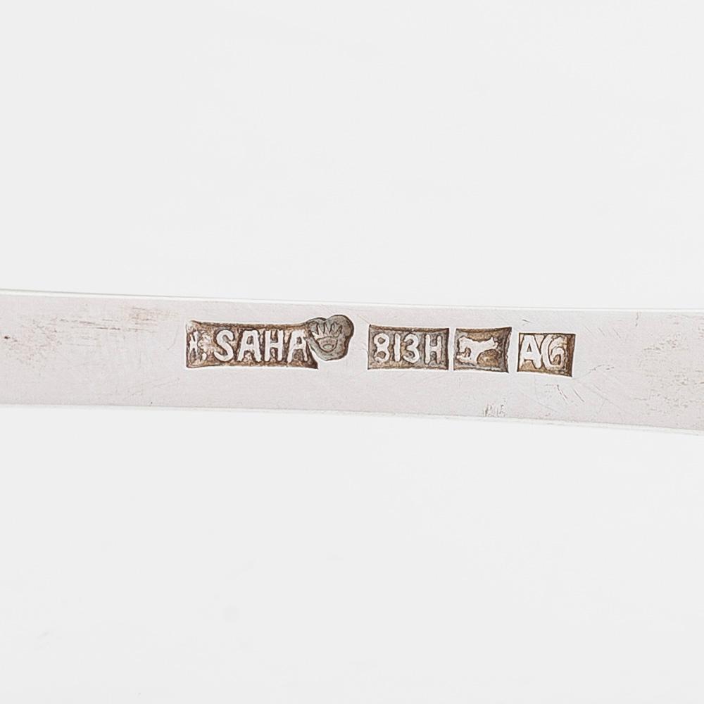 Ilmari Saha, a 12-piece set of silver table spoons in original boxes, Pori, Finland 1927-31.