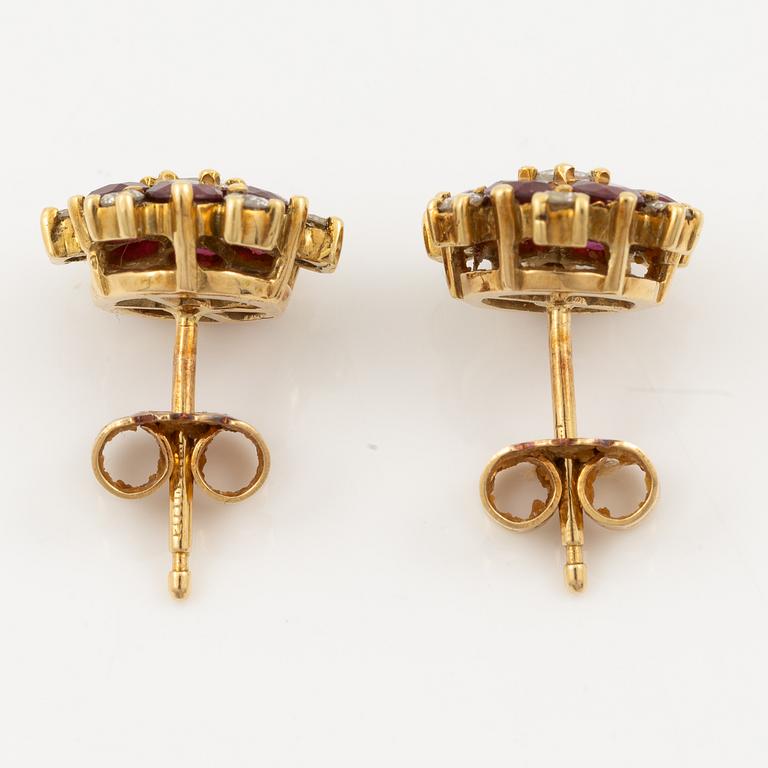 Earrings, a pair, 18K gold with rubies and brilliant-cut diamonds.