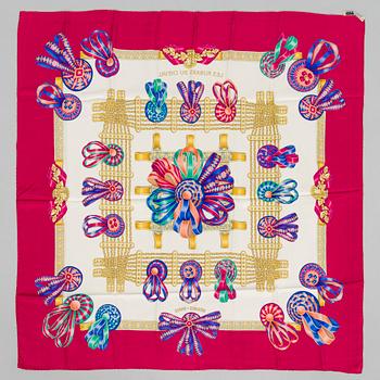 Hermès, a 'Les Rubans du Cheval' silk scarf.