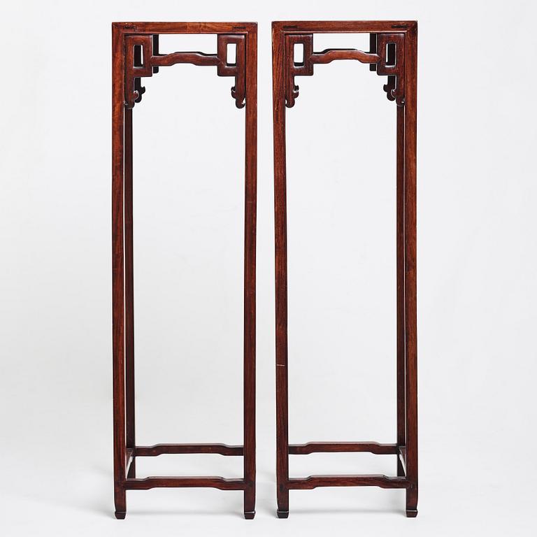 A pair of Chinese pidestals, 20th Century.