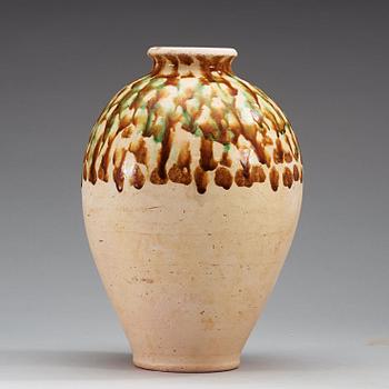 A Sancai-glazed pottery jar, Tang Dynasty (618-907).