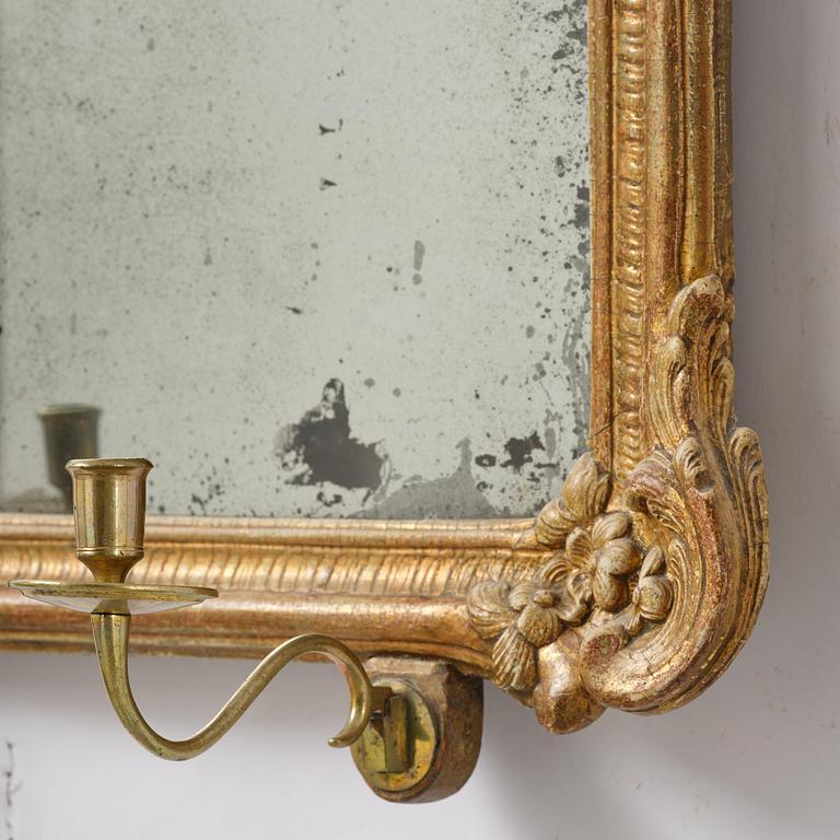 A two-branch giltwood rococo girandole mirror, Stockholm, later part 18th century.