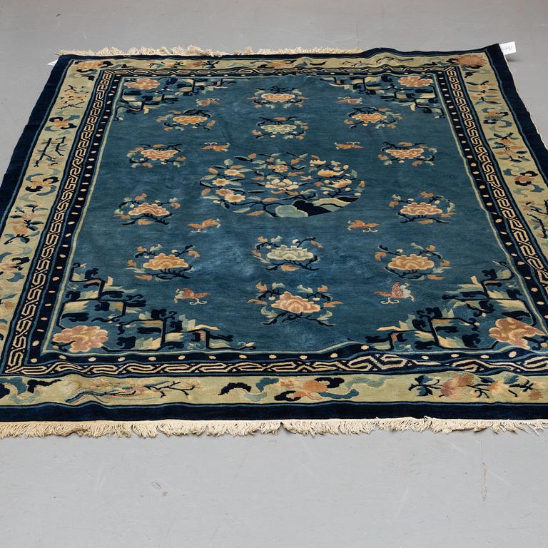 A CARPET, an old China, "antique finish", ca 270,5-273,5 x 181-186 cm (as well as ca 1 cm flat weave at the sides).