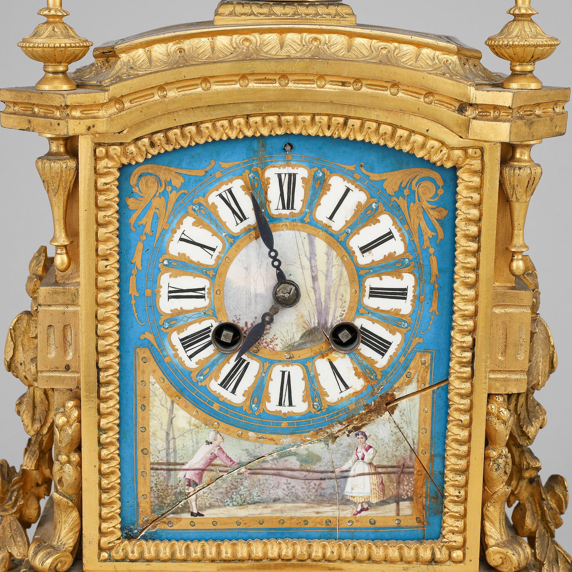 A late 19th Century bronze and porelain mantel clock.