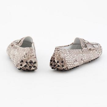 TOD'S, a pair of leather embossed loafers.