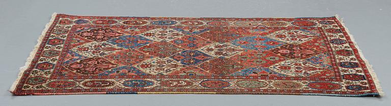 A RUG, an old Bachtiari, ca 213,5 x 142-147,5 cm.