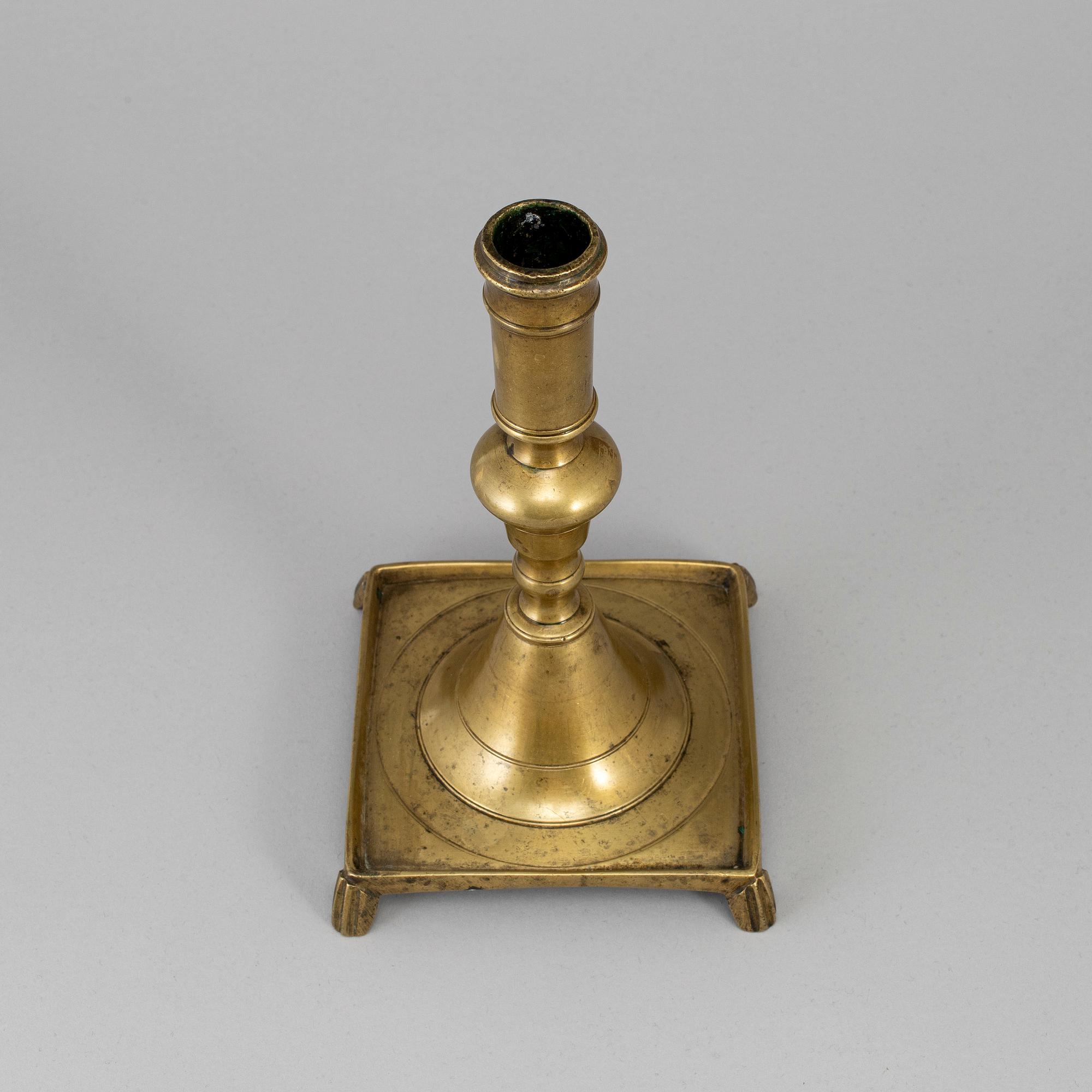 A 17th century bronze candlestick.