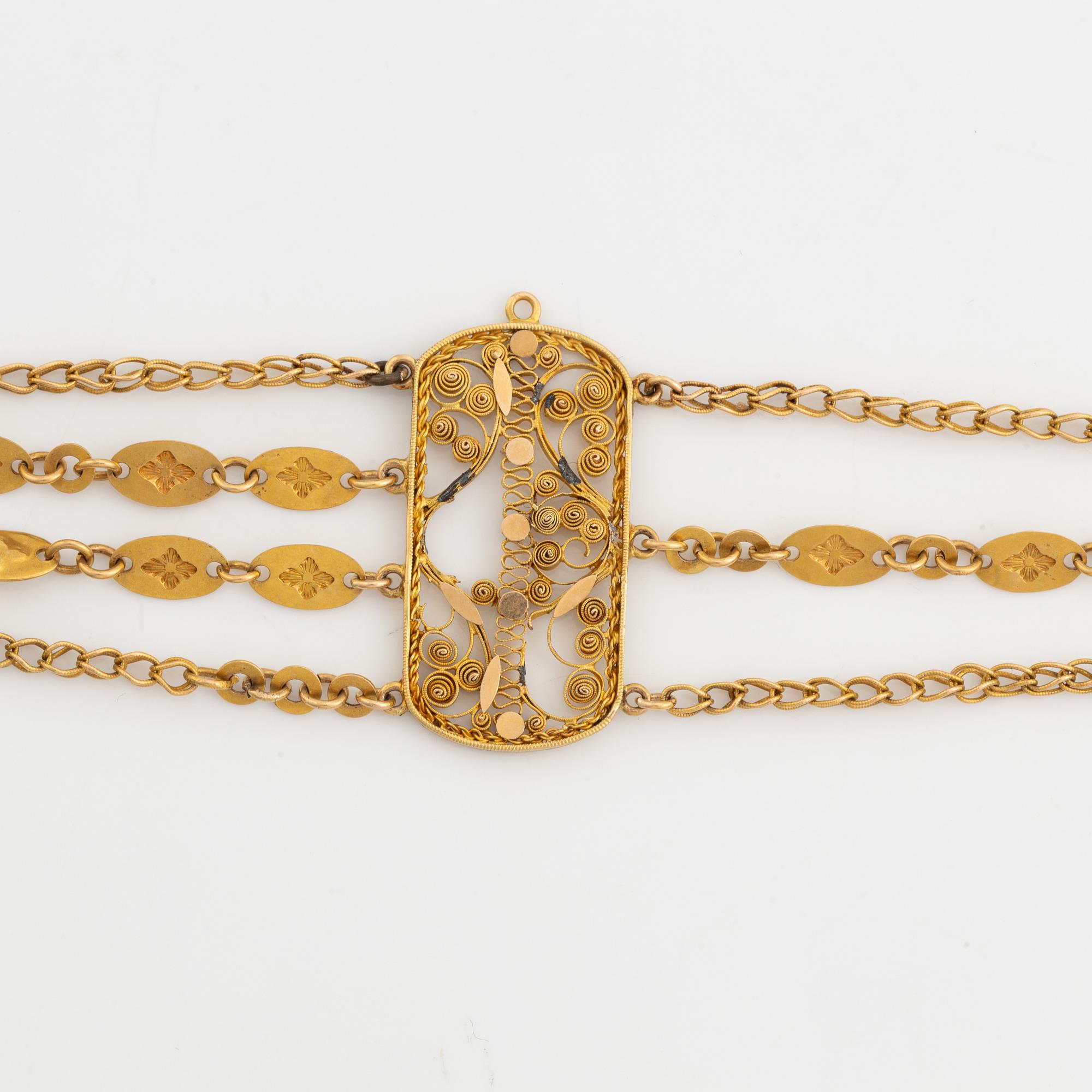 An 18K gold bracelet.