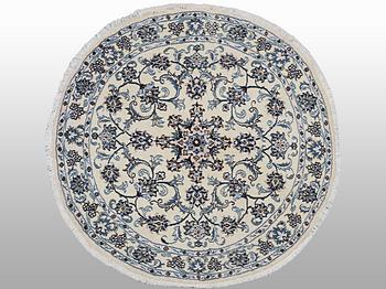 A rug, Nain, part silk, ca 146 x 146 cm.