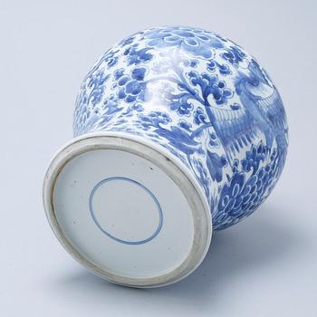 A blue and white Chinese Kangxi vase.