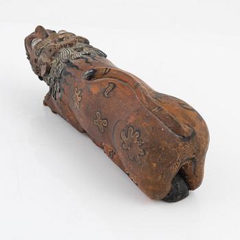 A wooden sculpture, South East Asia, 20th Century.