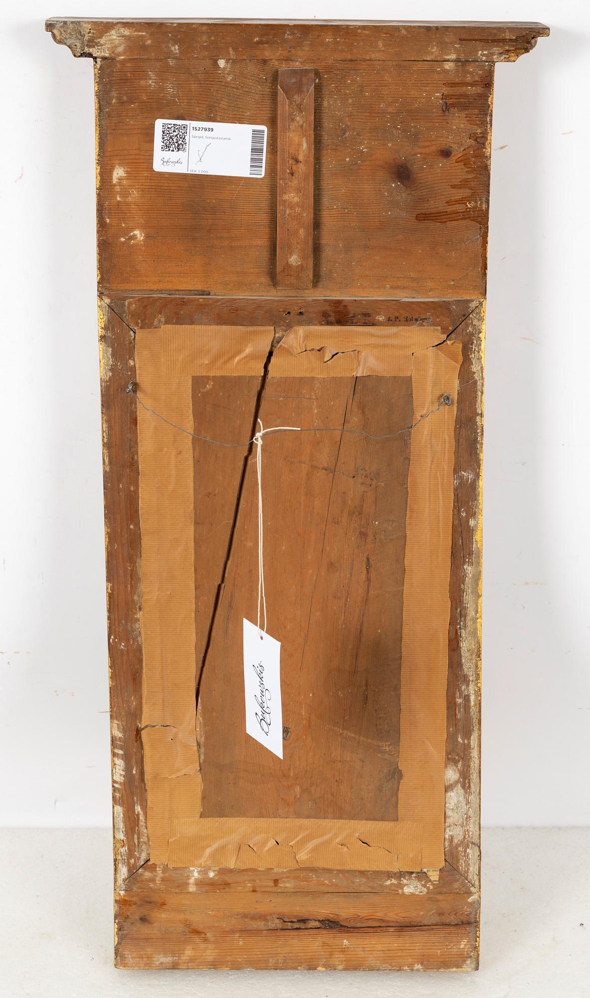 A giltwood Empire mirror by J. P. Holmberg (active in Stockholm 1813 - 1831).
