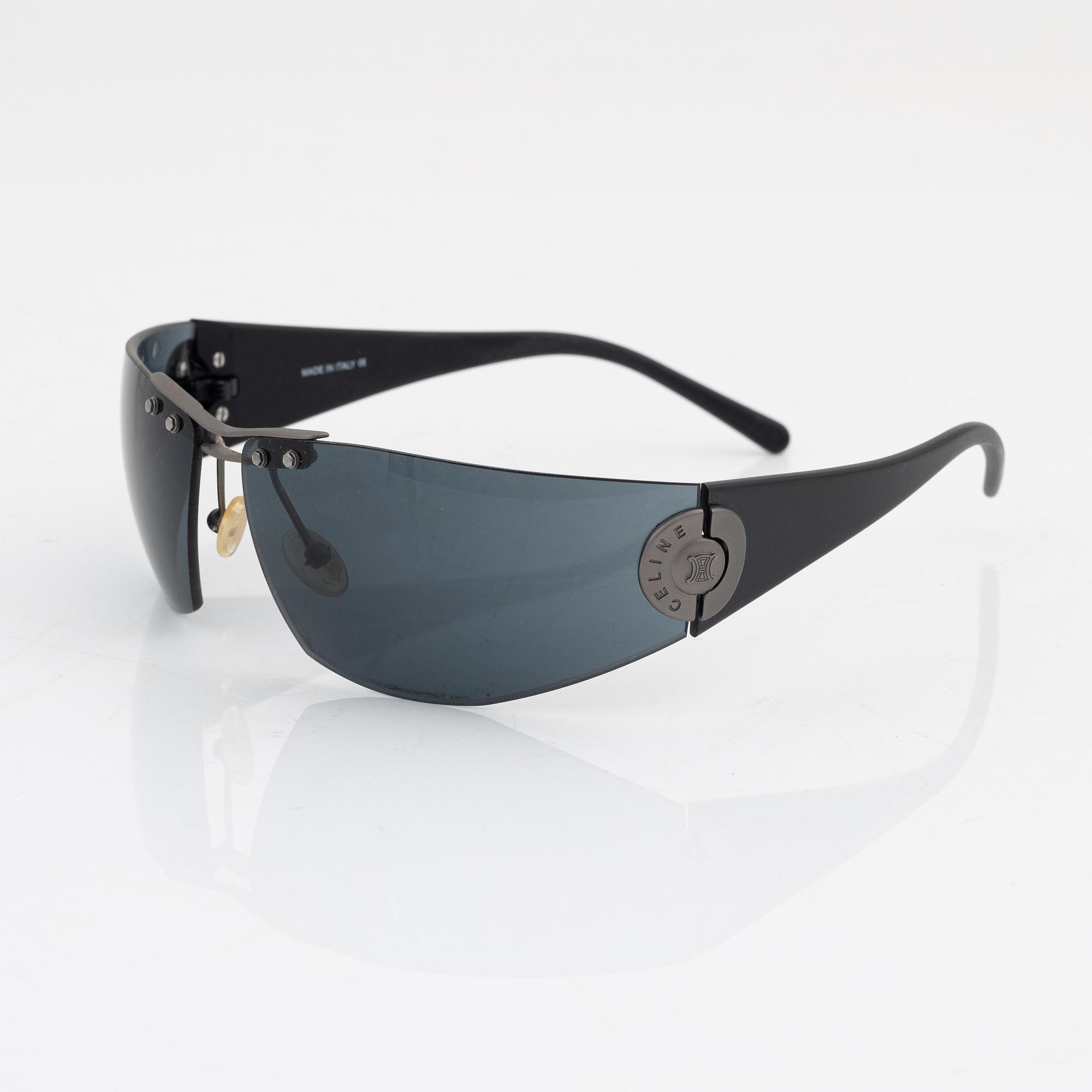 Céline, a pair of black and silver-color sunglasses.