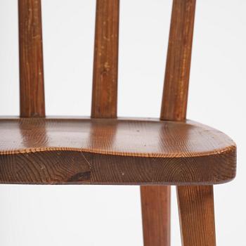 Axel Einar Hjorth, a set of four stained pine "Utö" chairs, Nordiska Kompaniet, Sweden, 1930s.