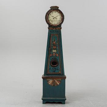 A painted grandfather clock, dated 1829.