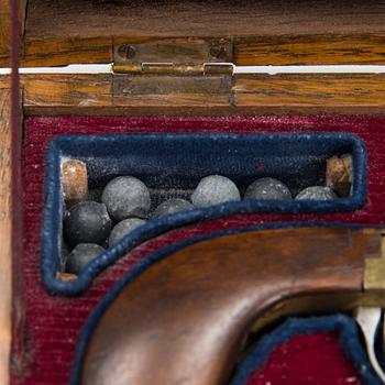 A mid 19th Century cased Belgian percussion pistol.