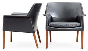 A pair of black leather easy chairs by Ejner Larsen and A Bender Madsen by Willy Beck, Denmark.