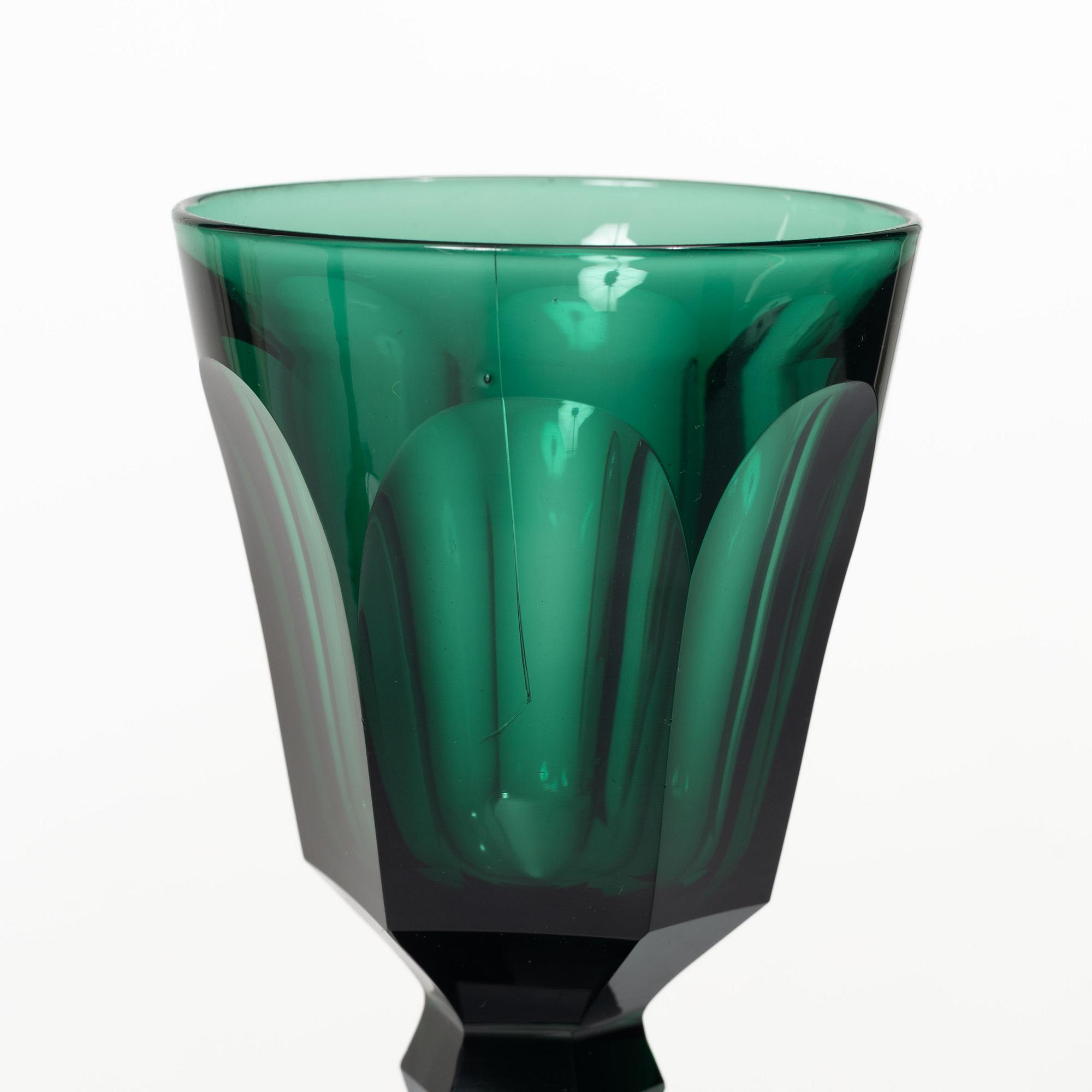 Eleven white wine glasses, green, 19th century.
