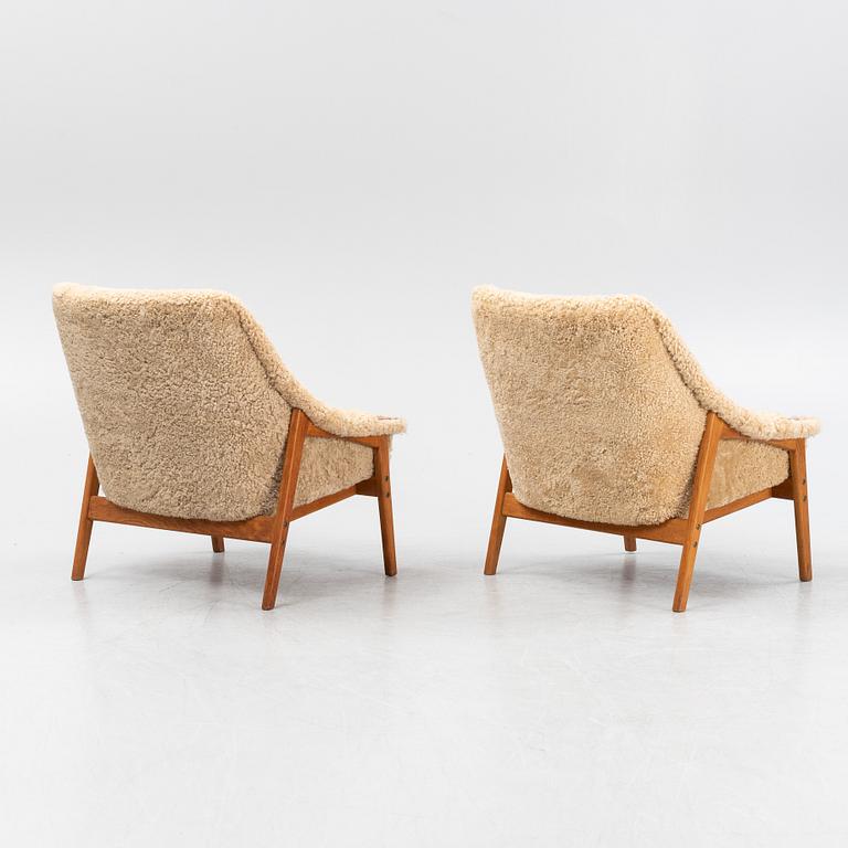 A pair of mid 20th Century easy chairs.