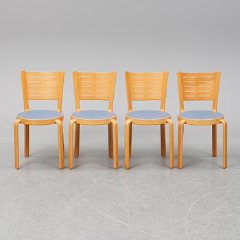 Table with four chairs, late 20th Century by Magnus Olesen.