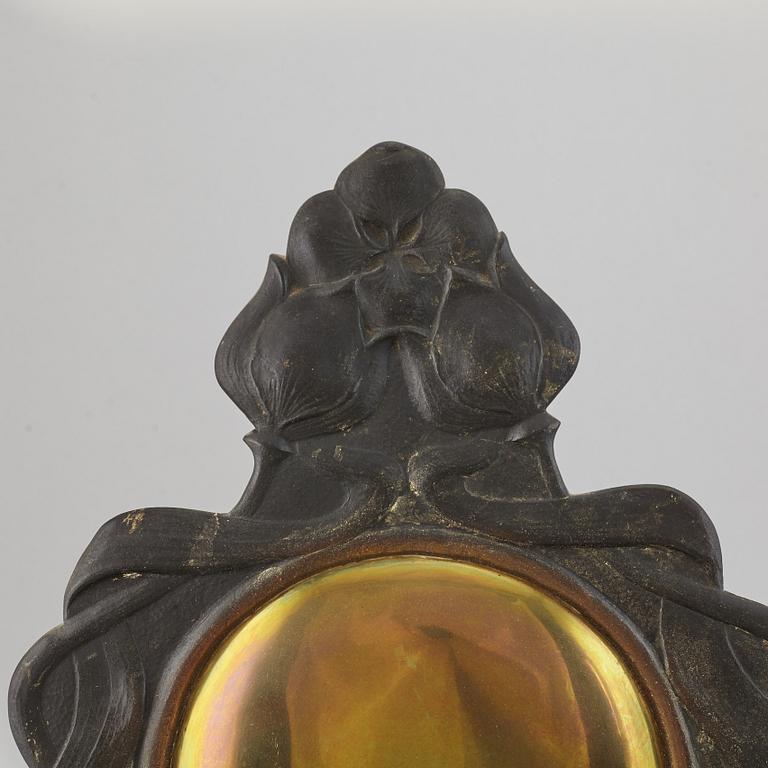 A pair of bronze and brass wall sconces from the early 20th century.