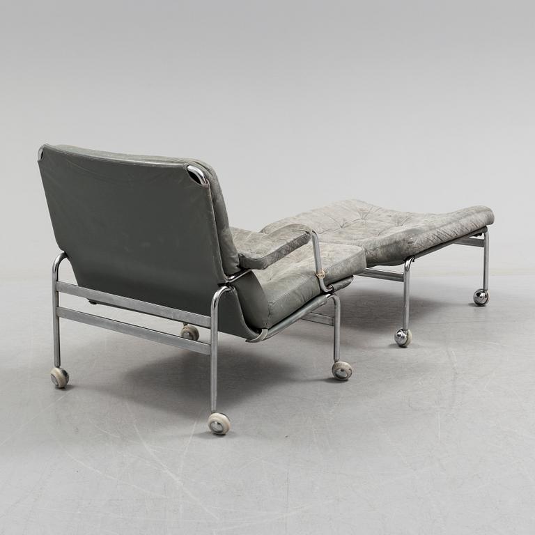 A second half of the 20th century easy chair and footstool.