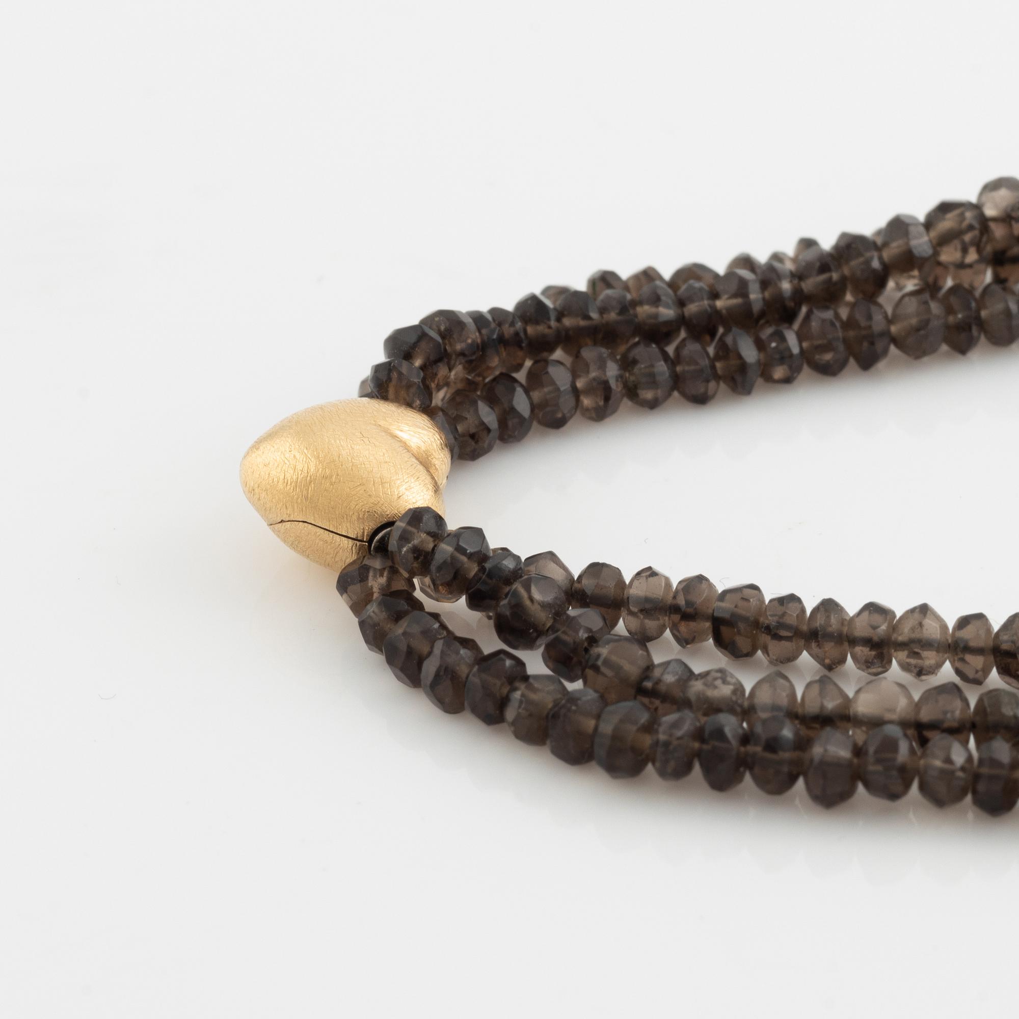 Ole Lynggaard,  smoky quartz necklace, clasp gold heart.