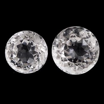 Two round faceted topazes.