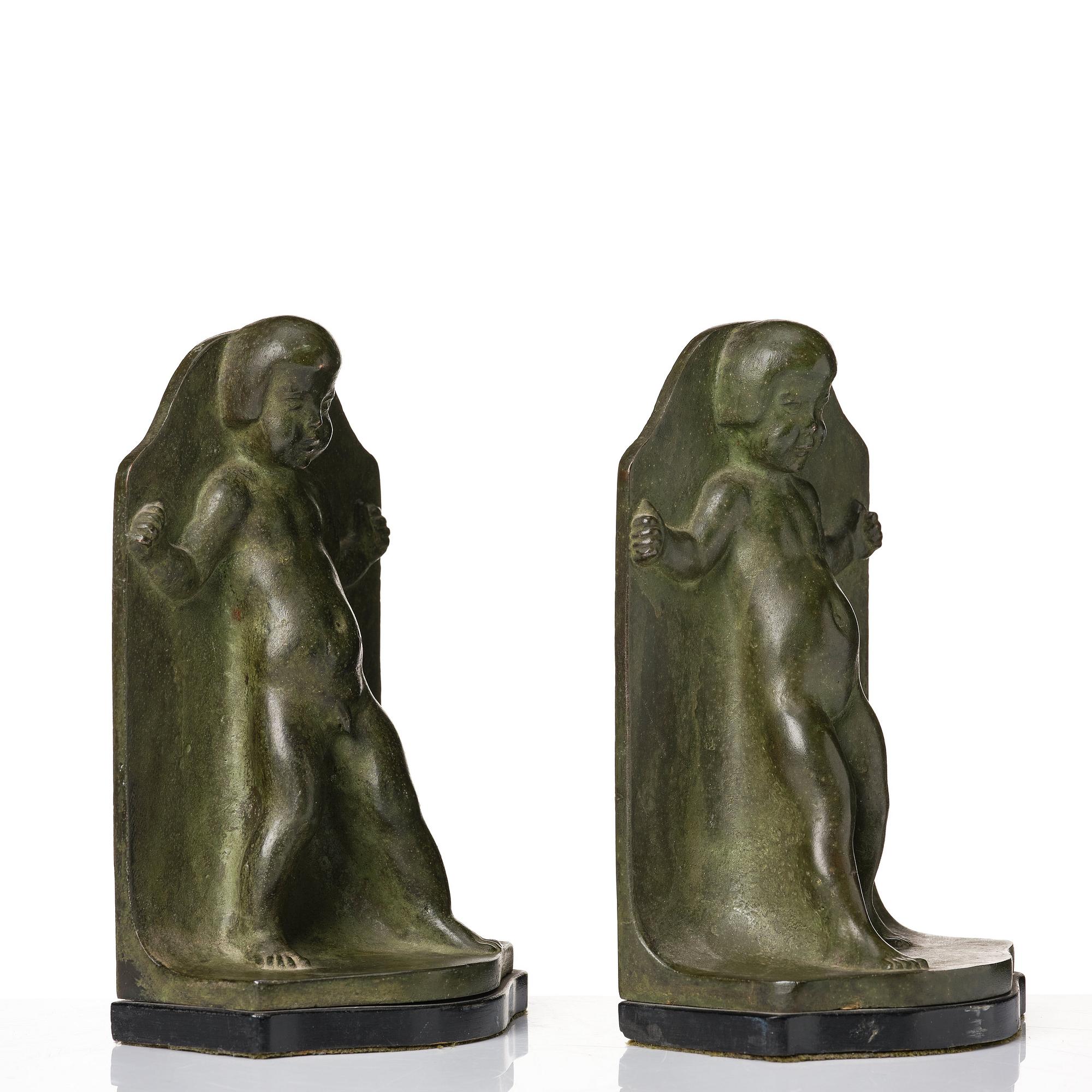 Axel Gute, a pair of green patinated metal bookends, Sweden, dated 1920.