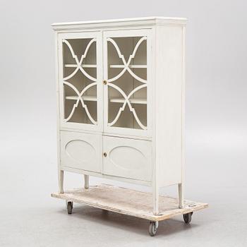 A display cabinet, early 20th Century.
