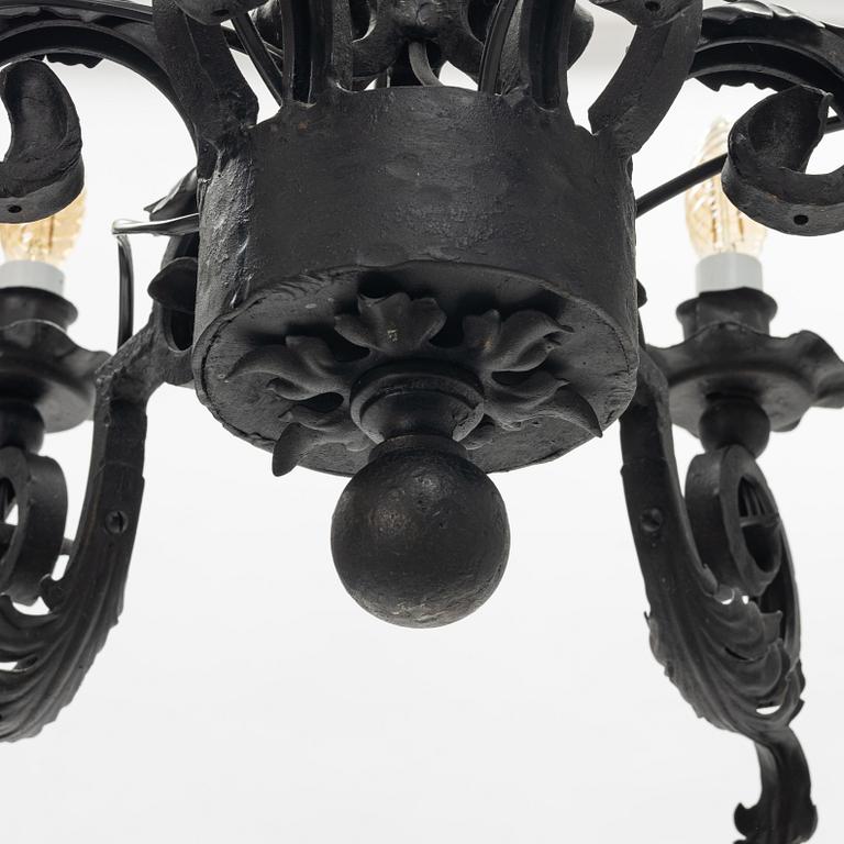 A black painted iron chandelier,