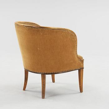 A Swedish Grace elm armchair, 'Bellman', attributed to Axel Einar Hjorth, Nordiska Kompaniet 1930.