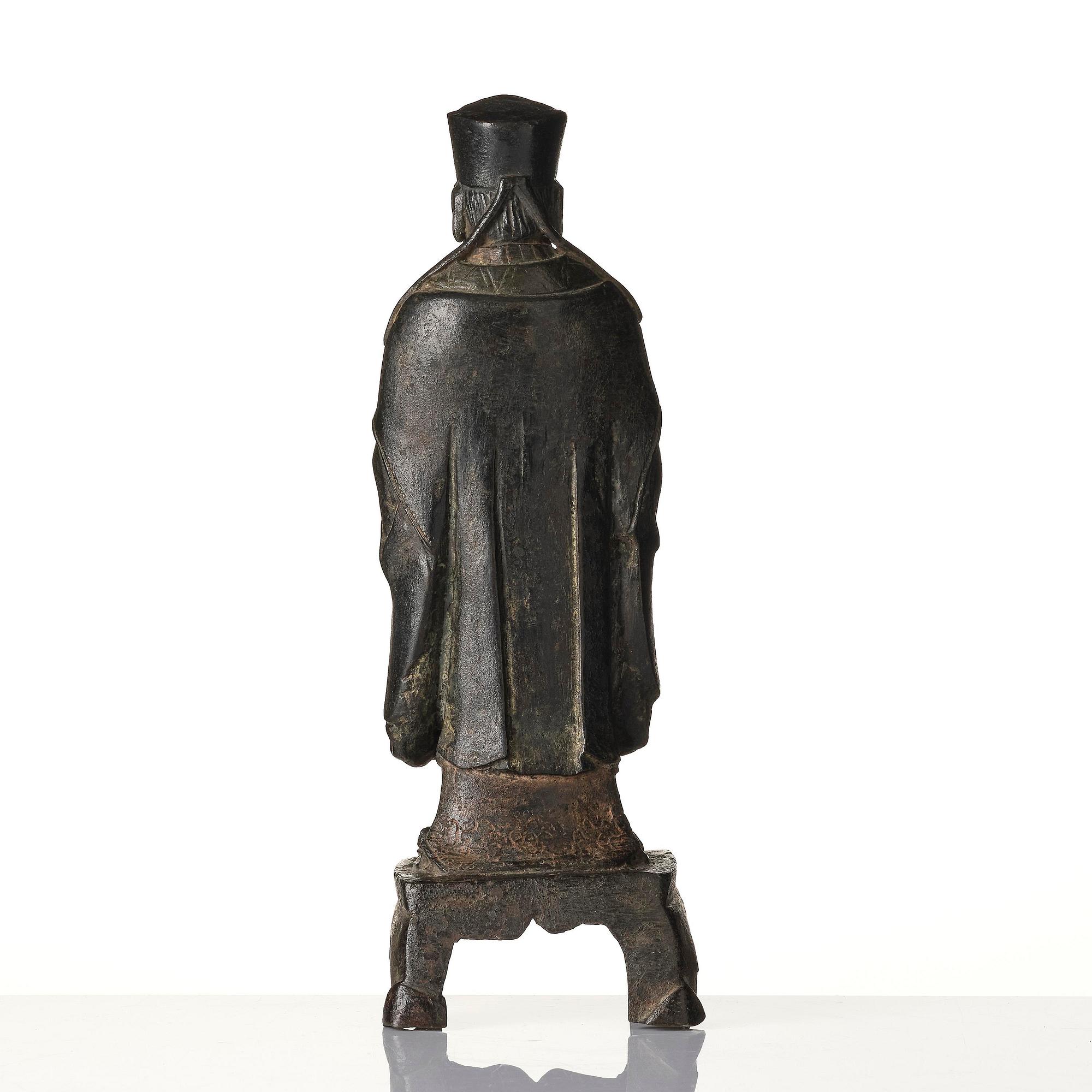 A bronze sculpture of a daoist immortal, Ming dynasty (1368-1644).