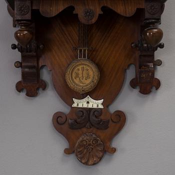 A circa 1900 Renaissance style wall clock.