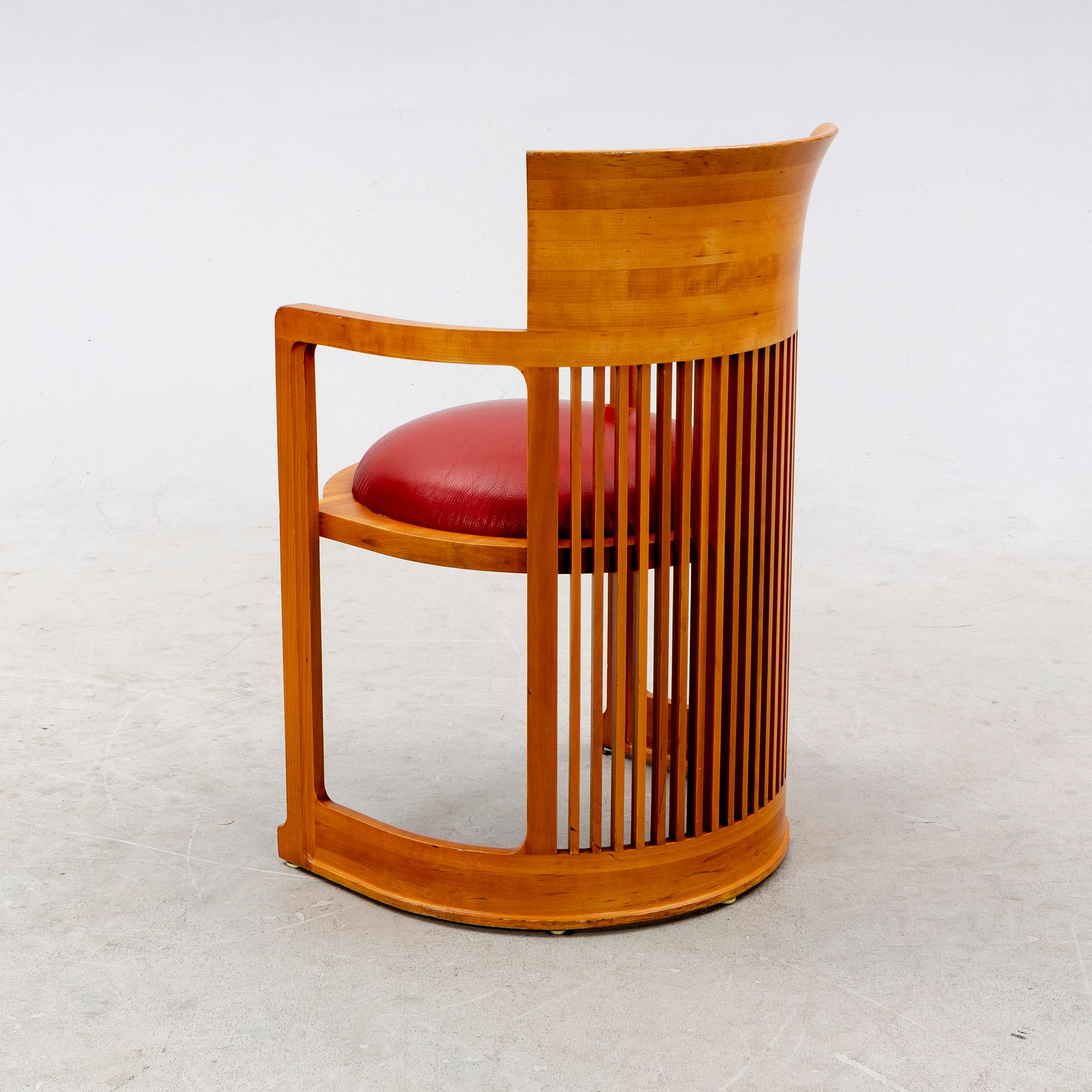 A cherry wood model 606 'Barrel' chair by Frank Lloyd Wright from Cassina.