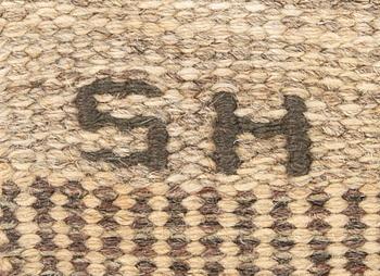 A Swedish flat weave carpet signed SH ca 243 x 162 cm.