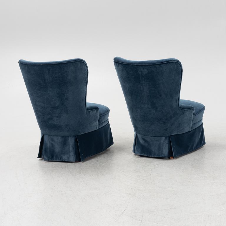 A pair of easy chairs, mid-20th century.
