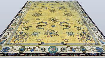 A Tabriz carpet, signed, approx. 388 x 280 cm.